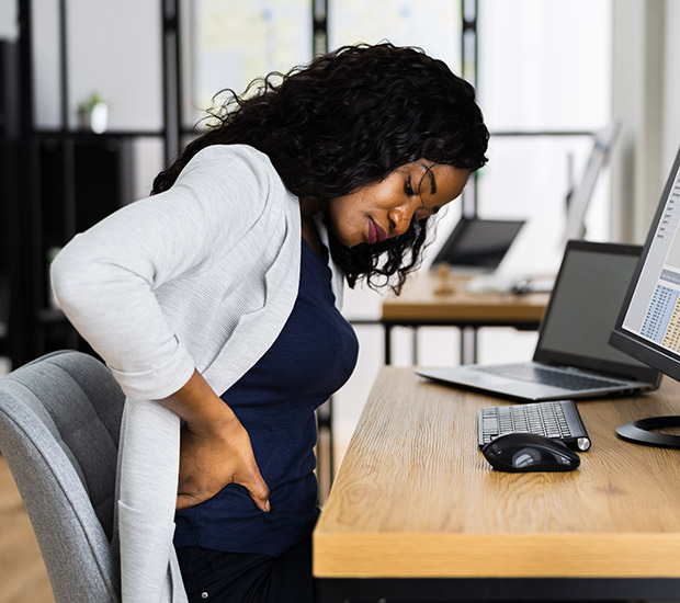 Office Worker Sitting with Back Pain